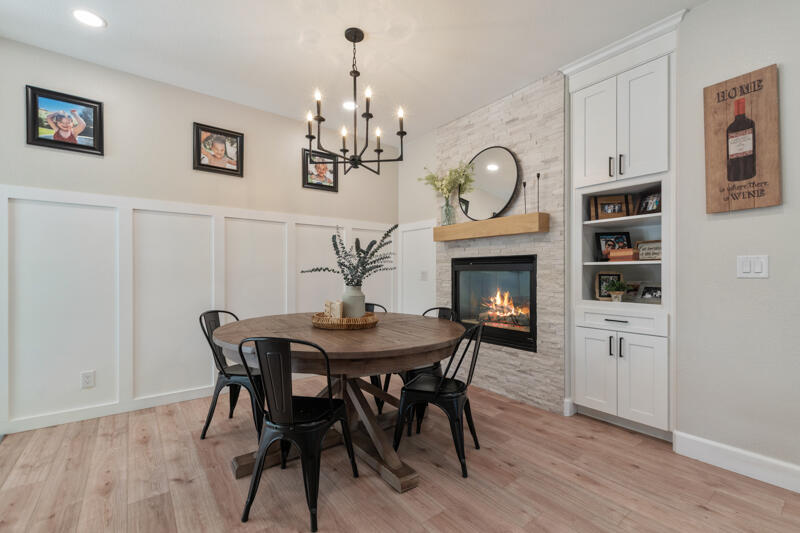 5470 Weatherby Court Reno, NV 89523 - Photo 12 of 33 a view of a dining room with furniture wooden floor and chandelier