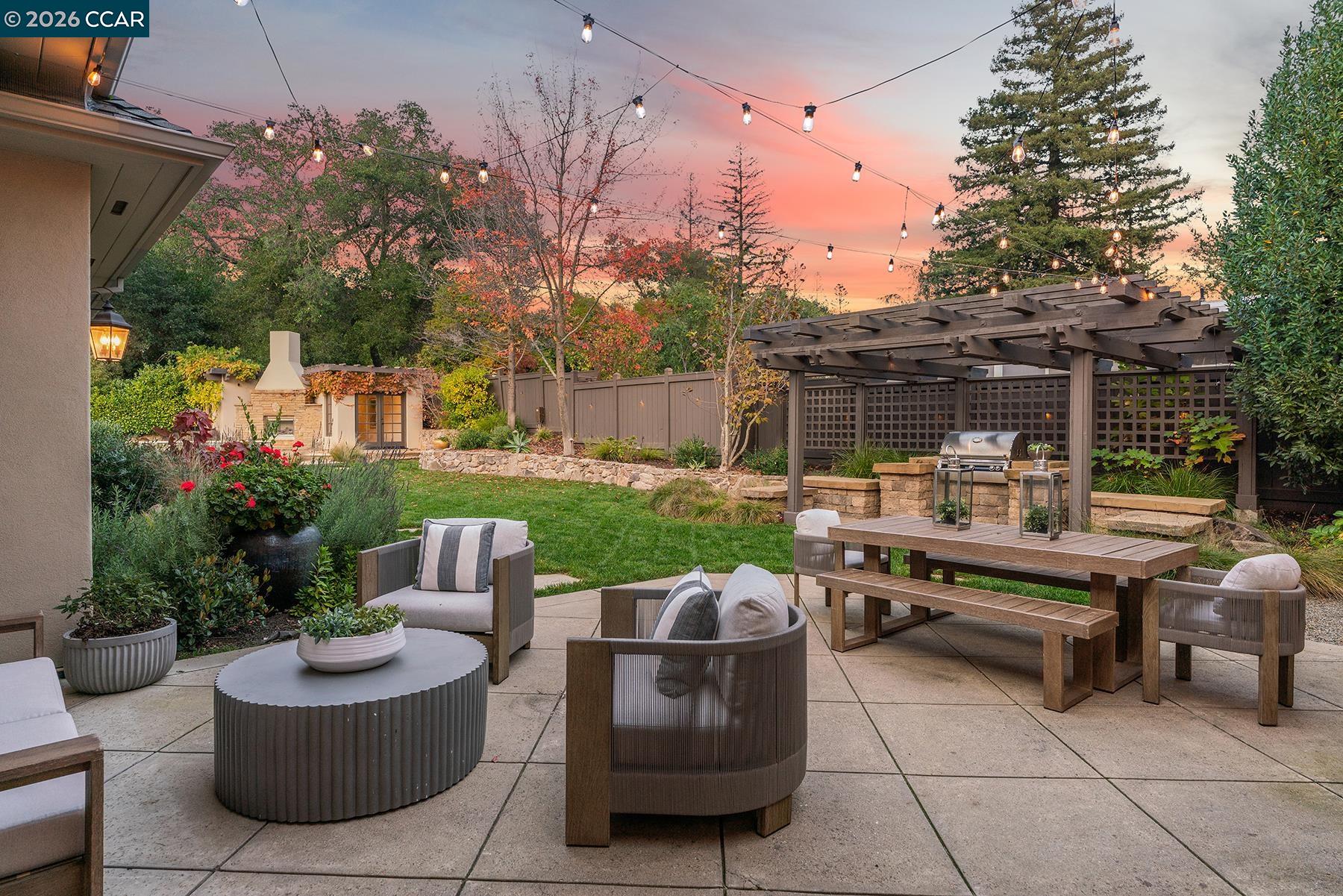 910 Carl Road Lafayette, CA 94549 - Photo 11 of 48 a view of a patio with couches chairs and a fire pit