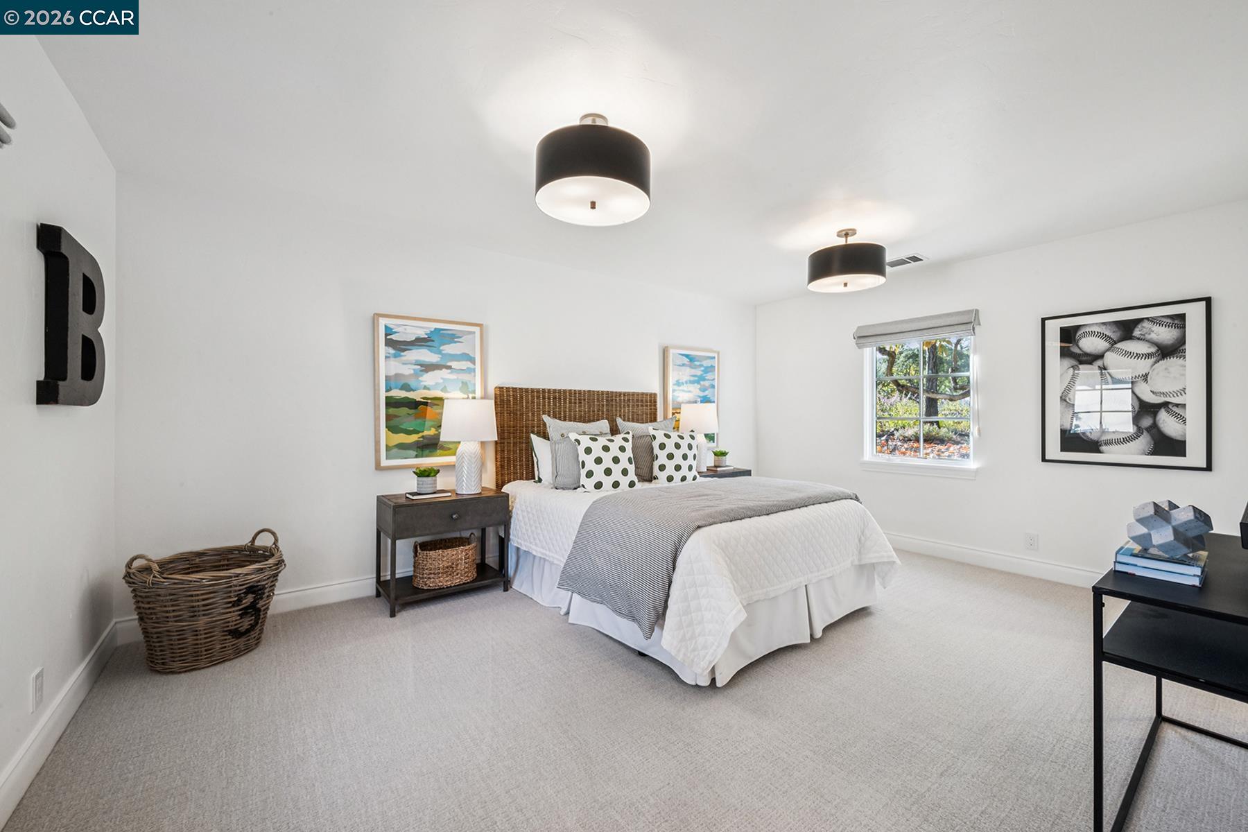 910 Carl Road Lafayette, CA 94549 - Photo 34 of 48 a spacious bedroom with a bed and a couch