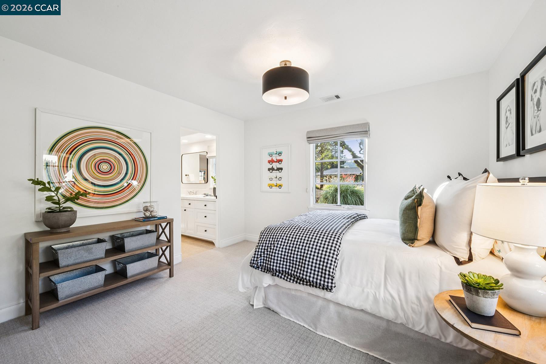 910 Carl Road Lafayette, CA 94549 - Photo 36 of 48 a bedroom with a bed and a chandelier