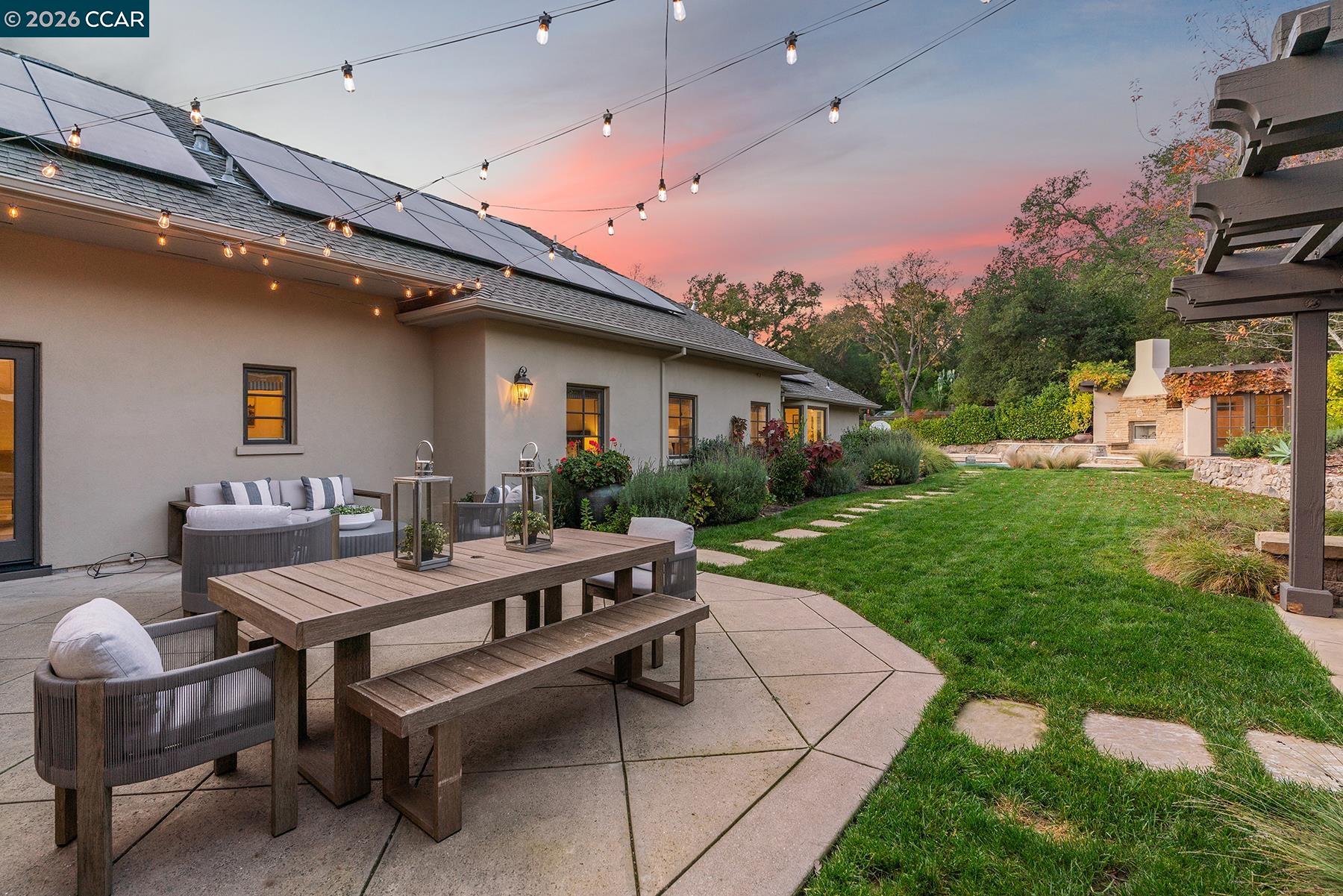910 Carl Road Lafayette, CA 94549 - Photo 4 of 48 a view of a patio with table and chairs and potted plants