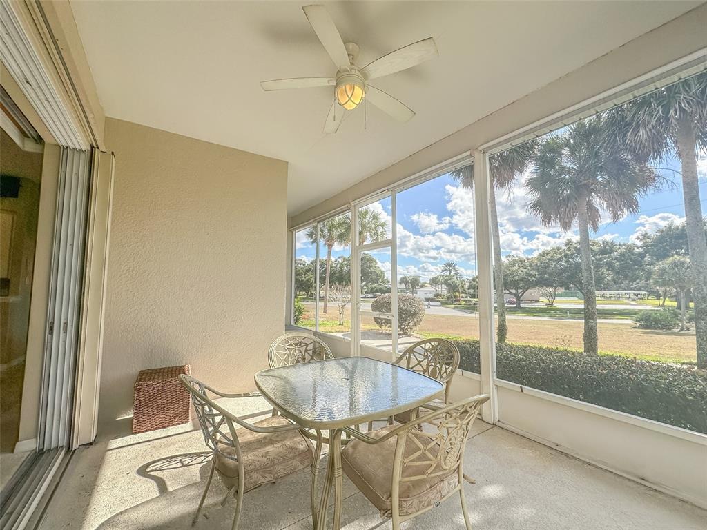5300 Treasure View Way Leesburg, FL 34748 - Photo 22 of 47 a dining room with furniture and window