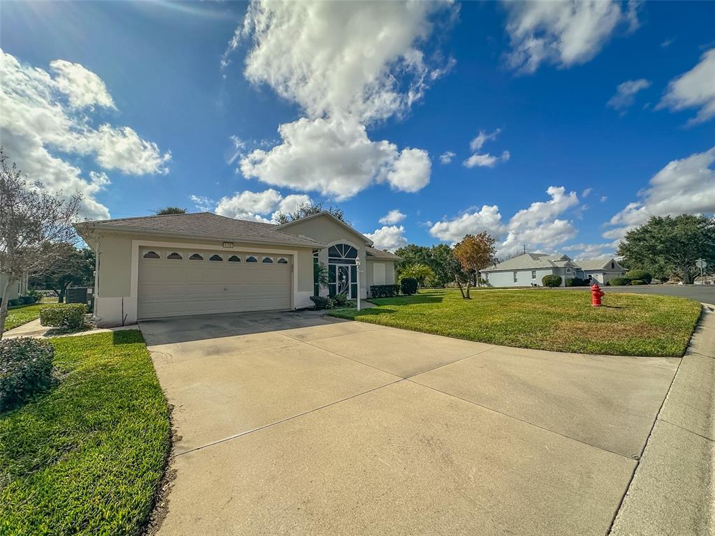 5300 Treasure View Way Leesburg, FL 34748 - Photo 26 of 47 a view of a house with a yard
