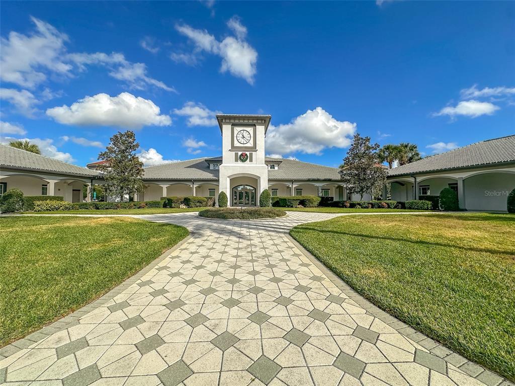 5300 Treasure View Way Leesburg, FL 34748 - Photo 29 of 47 a front view of a house with a garden