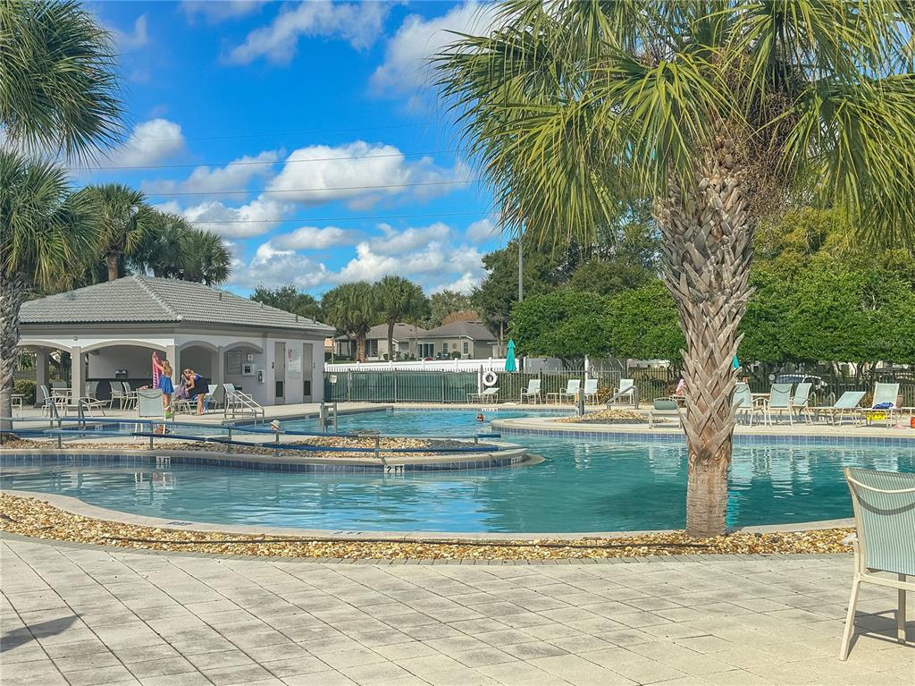 5300 Treasure View Way Leesburg, FL 34748 - Photo 30 of 47 a view of pool with umbrella and trees around