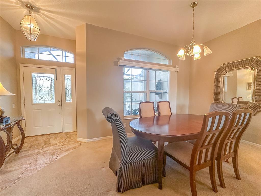 5300 Treasure View Way Leesburg, FL 34748 - Photo 4 of 47 a dining room with furniture and window