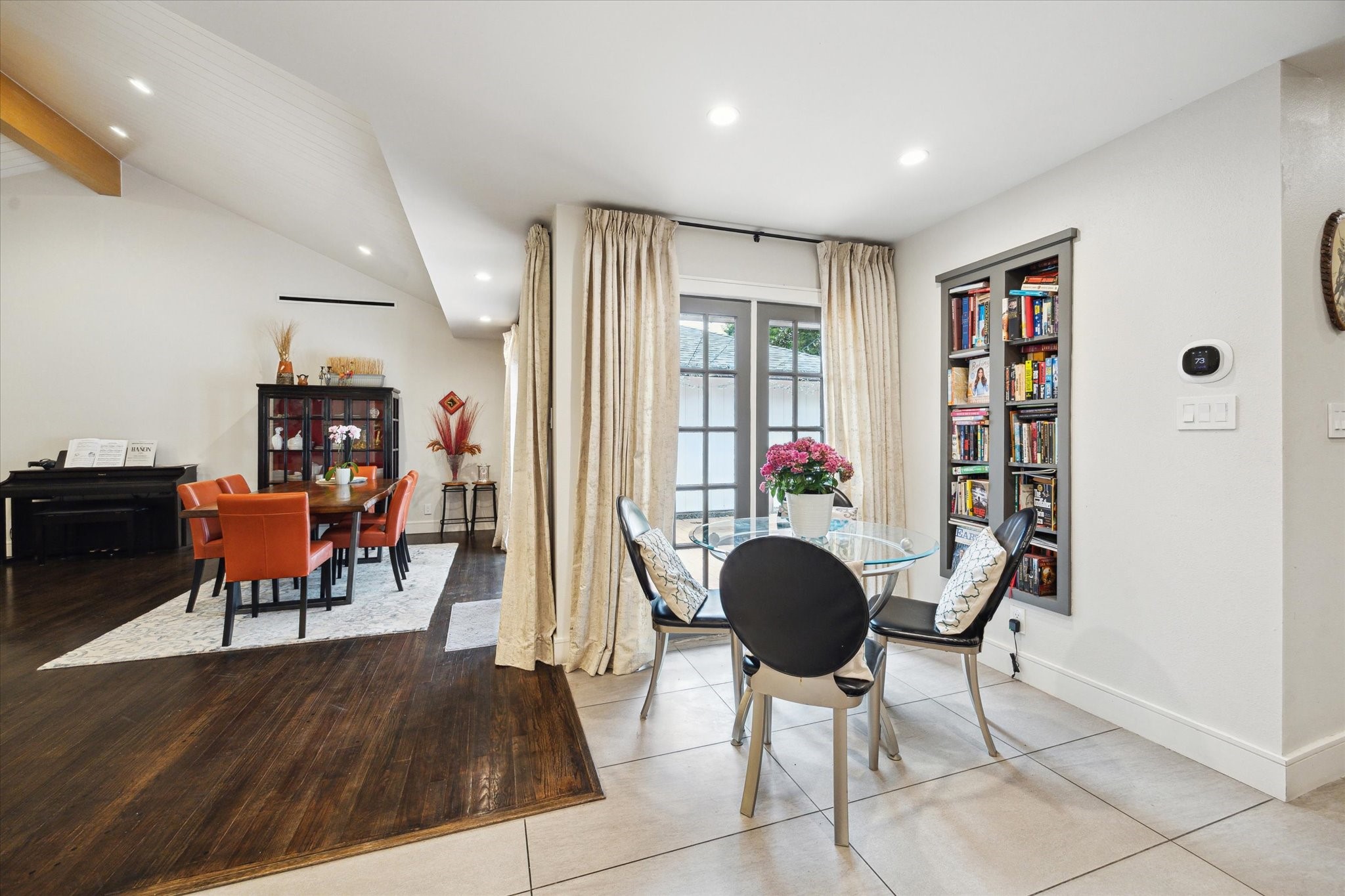 1902 Chimney Rock Road Houston, TX 77057 - Photo 17 of 32 From the kitchen another view of the formal dining area with lovely wood floors and a view or outside patio from both rooms!