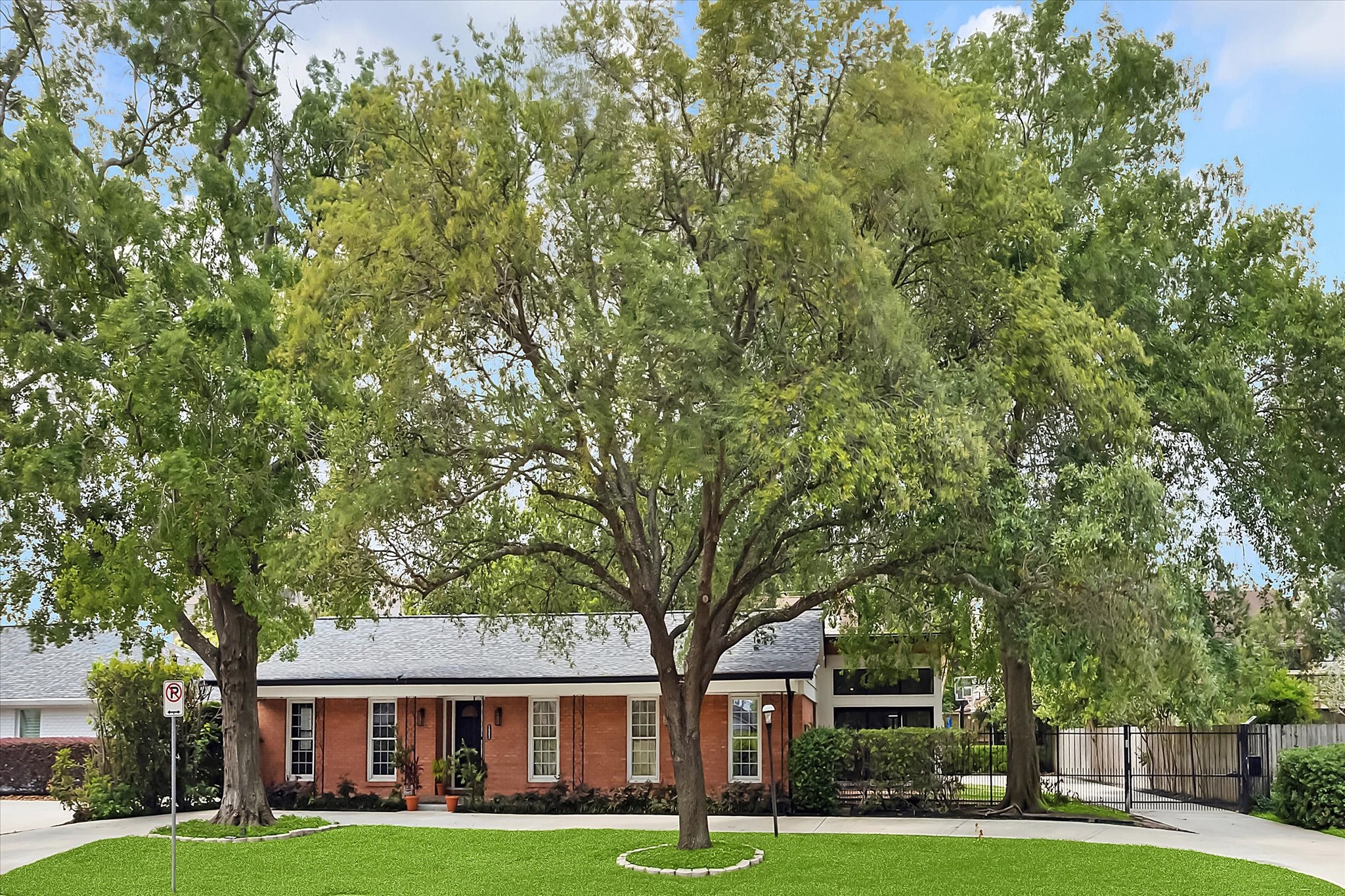 1902 Chimney Rock Road Houston, TX 77057 - Photo 2 of 32 The sq. ft. was expanded and a 4th bedroom/game room/study with full bath was recently added on. Notice the iron gate area which adds extra parking spaces.