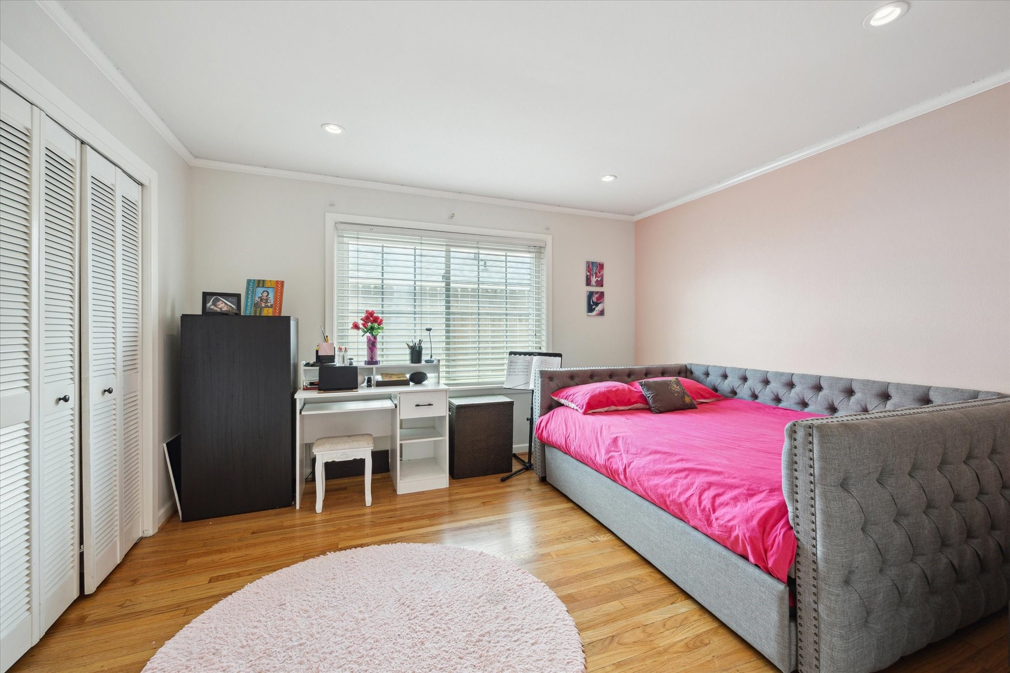 1902 Chimney Rock Road Houston, TX 77057 - Photo 26 of 32 Another lovely room for a teen or child with great louvered doors and room for a desk and dressers.