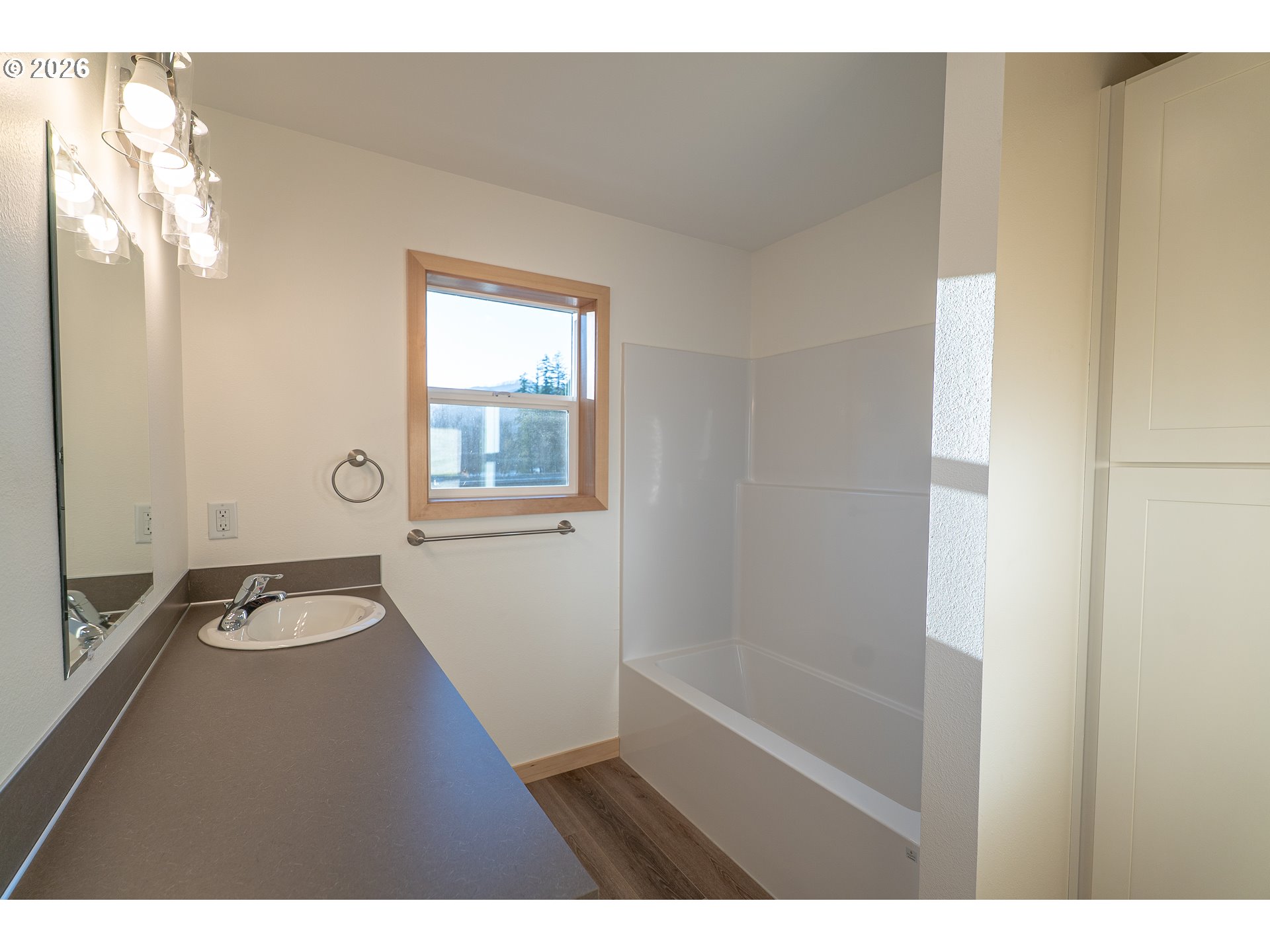 51702 Rose Street Blue River, OR 97413 - Photo 16 of 17 a bathroom with a granite countertop sink a toilet and a mirror