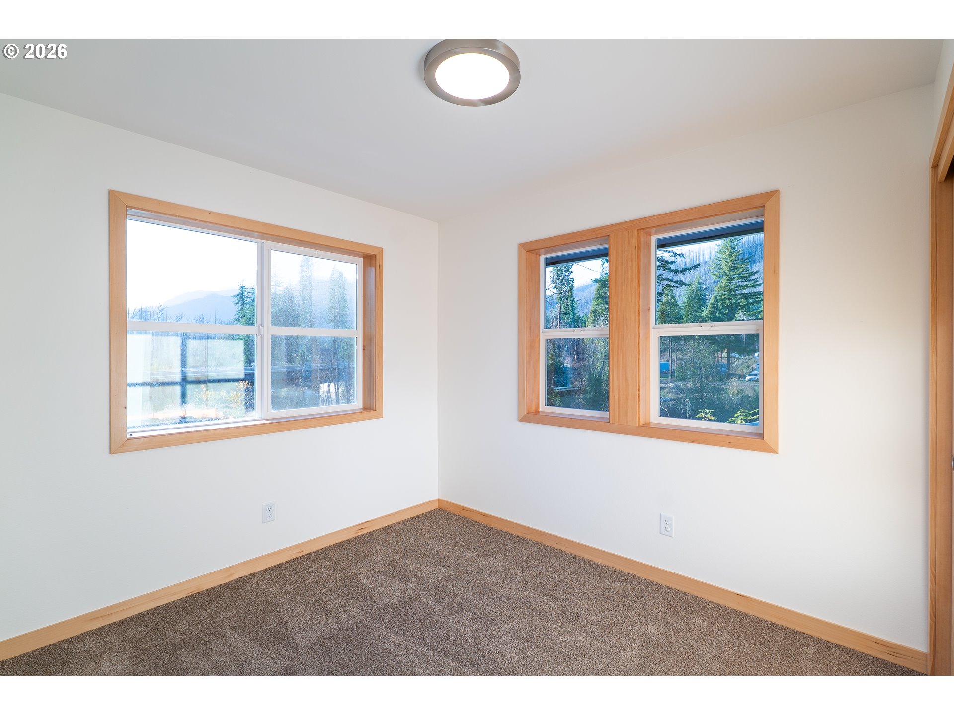 51702 Rose Street Blue River, OR 97413 - Photo 3 of 17 a view of an empty room with a window