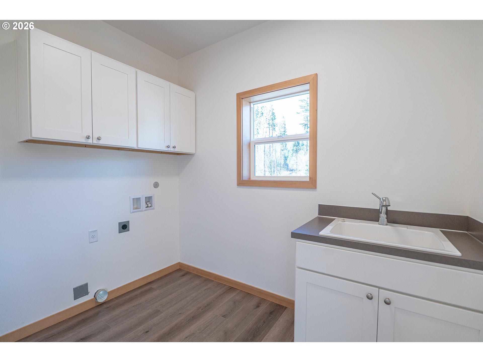 51702 Rose Street Blue River, OR 97413 - Photo 7 of 17 a kitchen with a sink cabinets and a window