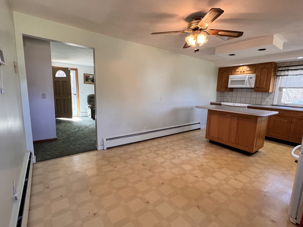 31 Upper Gore Road Webster, MA 01570 - Photo 11 of 33 a view of a kitchen with a sink and a refrigerator