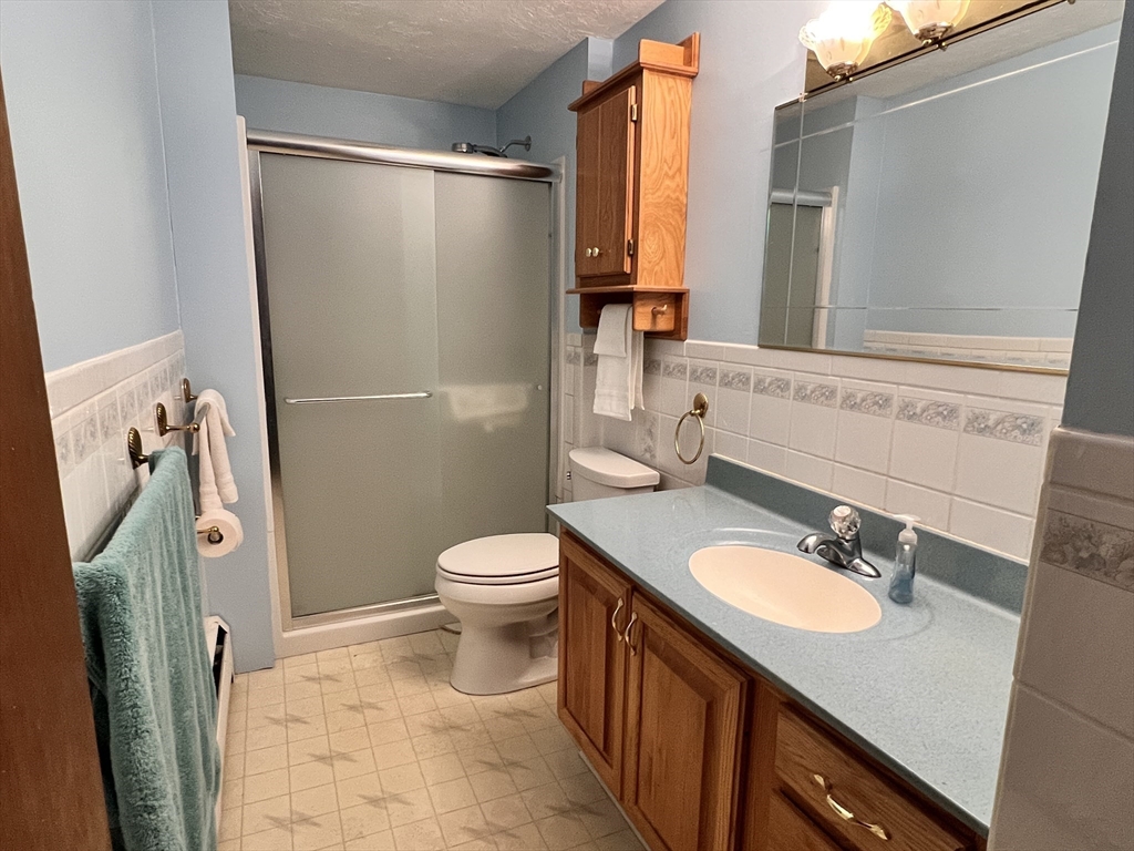 31 Upper Gore Road Webster, MA 01570 - Photo 13 of 33 a bathroom with a sink toilet and shower