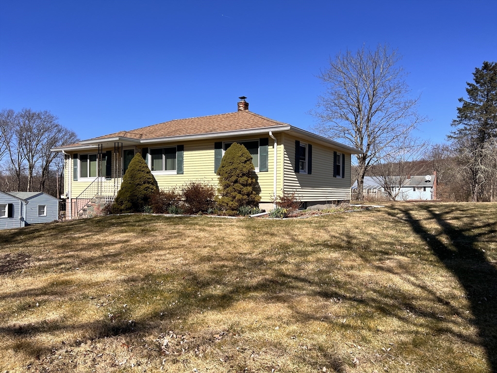 31 Upper Gore Road Webster, MA 01570 - Photo 3 of 33 a front view of a house with garden