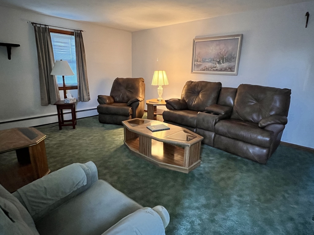 31 Upper Gore Road Webster, MA 01570 - Photo 5 of 33 a living room with furniture and a couch