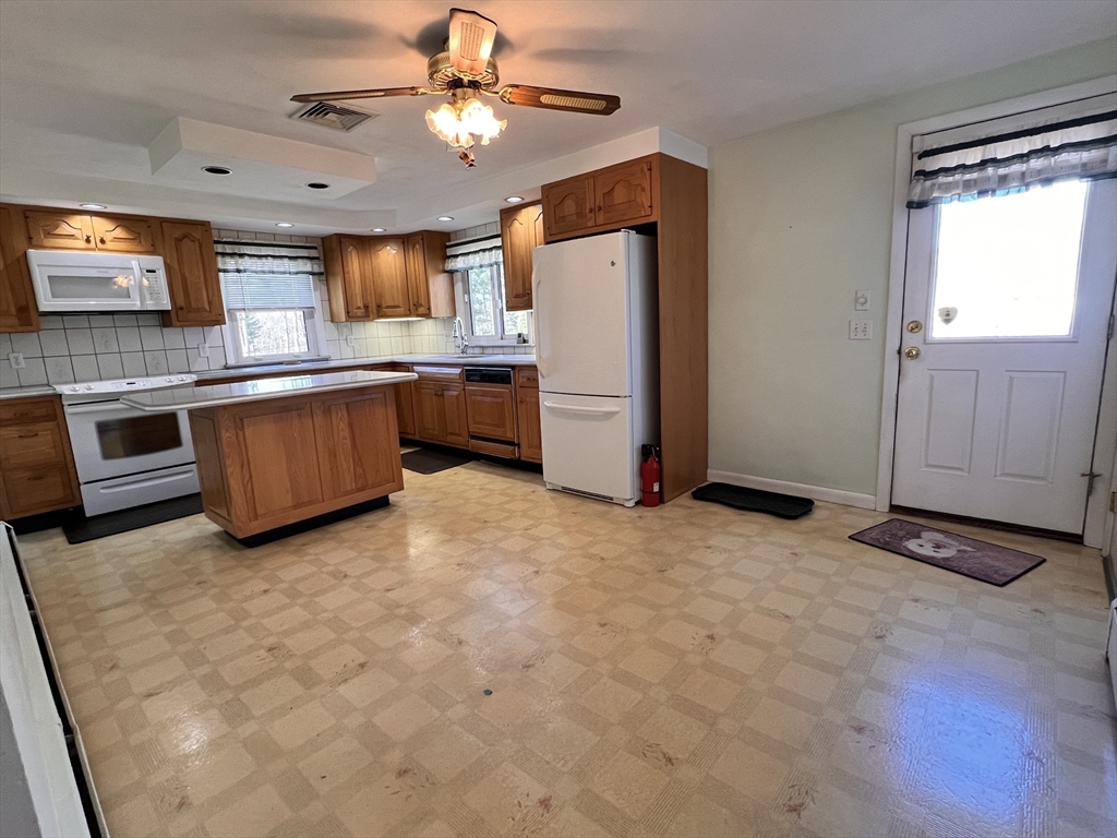 31 Upper Gore Road Webster, MA 01570 - Photo 7 of 33 a kitchen with stainless steel appliances granite countertop a refrigerator a oven a sink and dishwasher