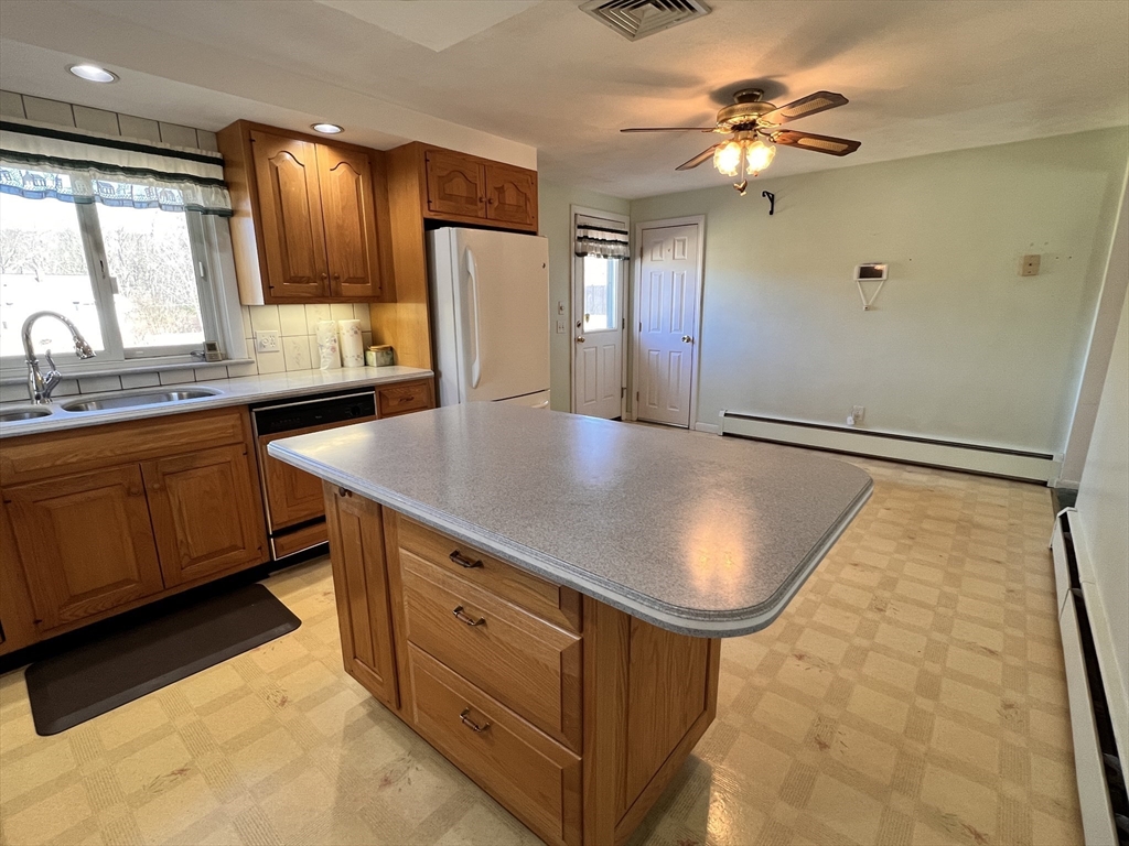 31 Upper Gore Road Webster, MA 01570 - Photo 8 of 33 a kitchen with stainless steel appliances granite countertop a sink a stove and refrigerator