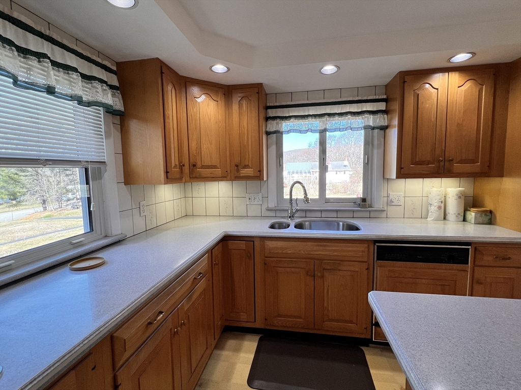 31 Upper Gore Road Webster, MA 01570 - Photo 9 of 33 a kitchen with a sink stove and cabinets