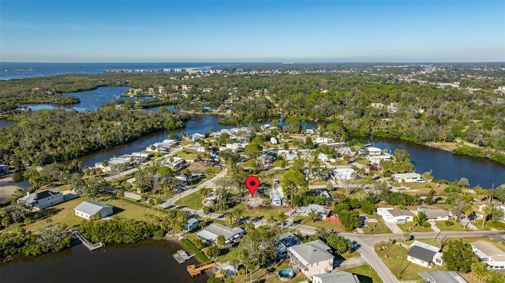 4836 Snug Harbor Road New Port Richey, FL 34652 - Photo 12 of 16 an aerial view of residential building and lake