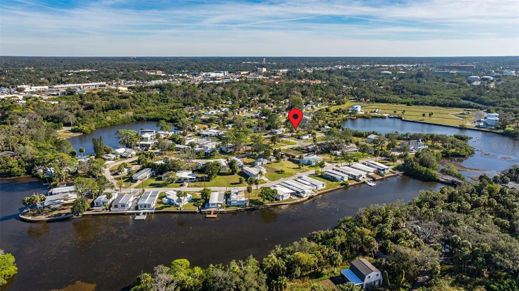 4836 Snug Harbor Road New Port Richey, FL 34652 - Photo 13 of 16 an aerial view of a houses with a lake view