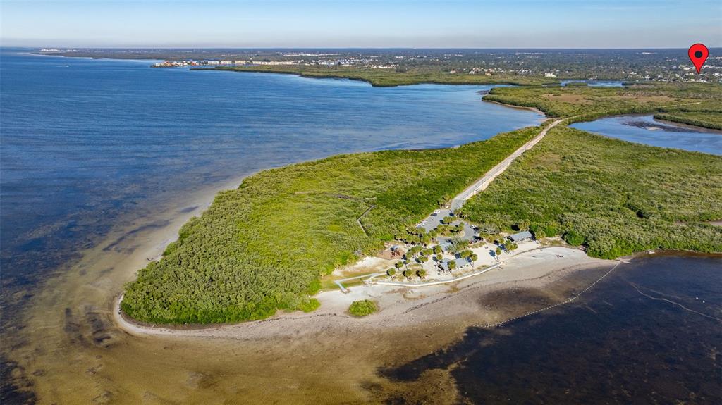4836 Snug Harbor Road New Port Richey, FL 34652 - Photo 15 of 16 a view of a lake with a mountain