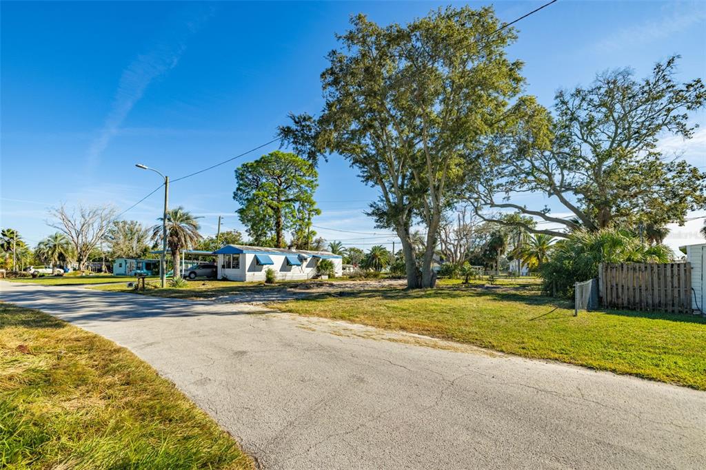 4836 Snug Harbor Road New Port Richey, FL 34652 - Photo 7 of 16 a view of a swimming pool and an outdoor space