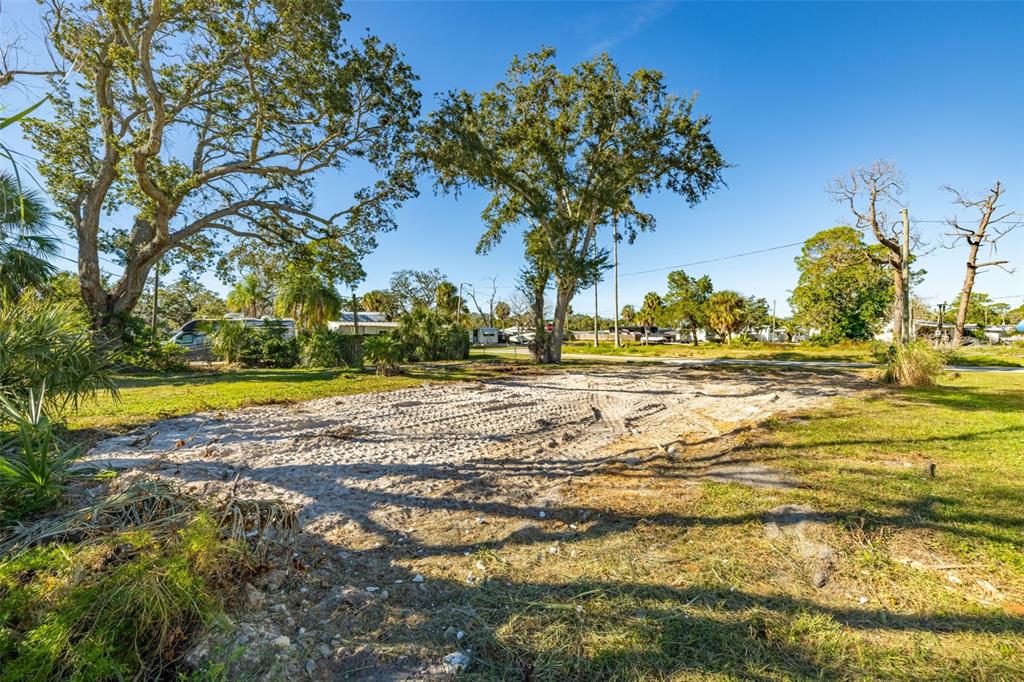 4836 Snug Harbor Road New Port Richey, FL 34652 - Photo 9 of 16 a view of yard with swimming pool and green space