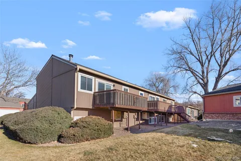 an aerial view of residential building with outdoor space and ocean view