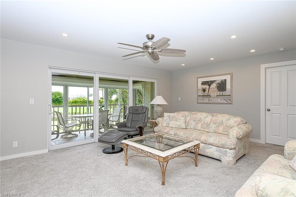 231 Memory Lane, Unit 4 Naples, FL 34112 - Photo 12 of 33 Triple sliding door opens for even more entertainment space