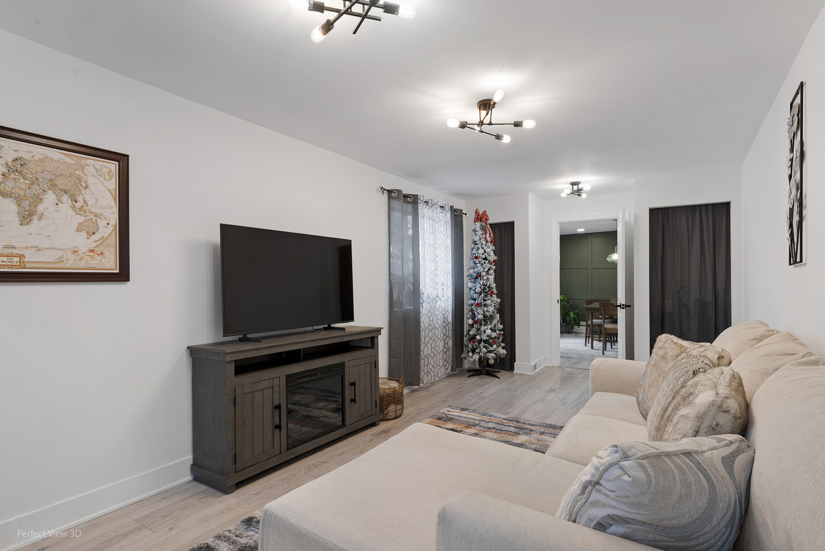 128 South Villa Avenue Addison, IL 60101 - Photo 11 of 27 a living room with furniture and a flat screen tv