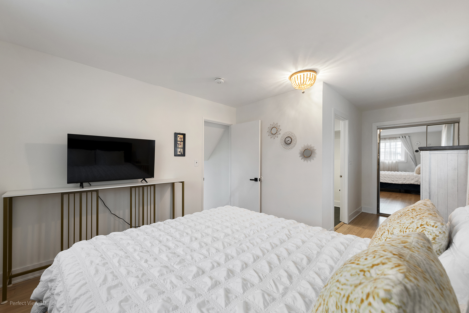 128 South Villa Avenue Addison, IL 60101 - Photo 13 of 27 a bedroom with a bed and a flat screen tv