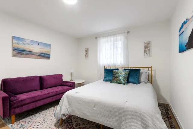 a bed room with a bed and a couch