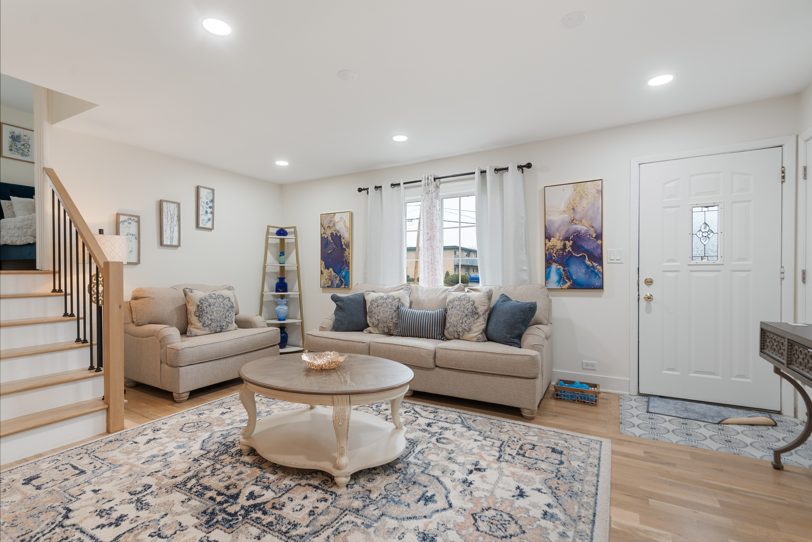 128 South Villa Avenue Addison, IL 60101 - Photo 2 of 27 a living room with furniture and a wooden floor