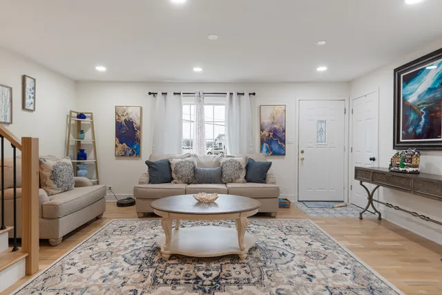 a living room with furniture and a rug