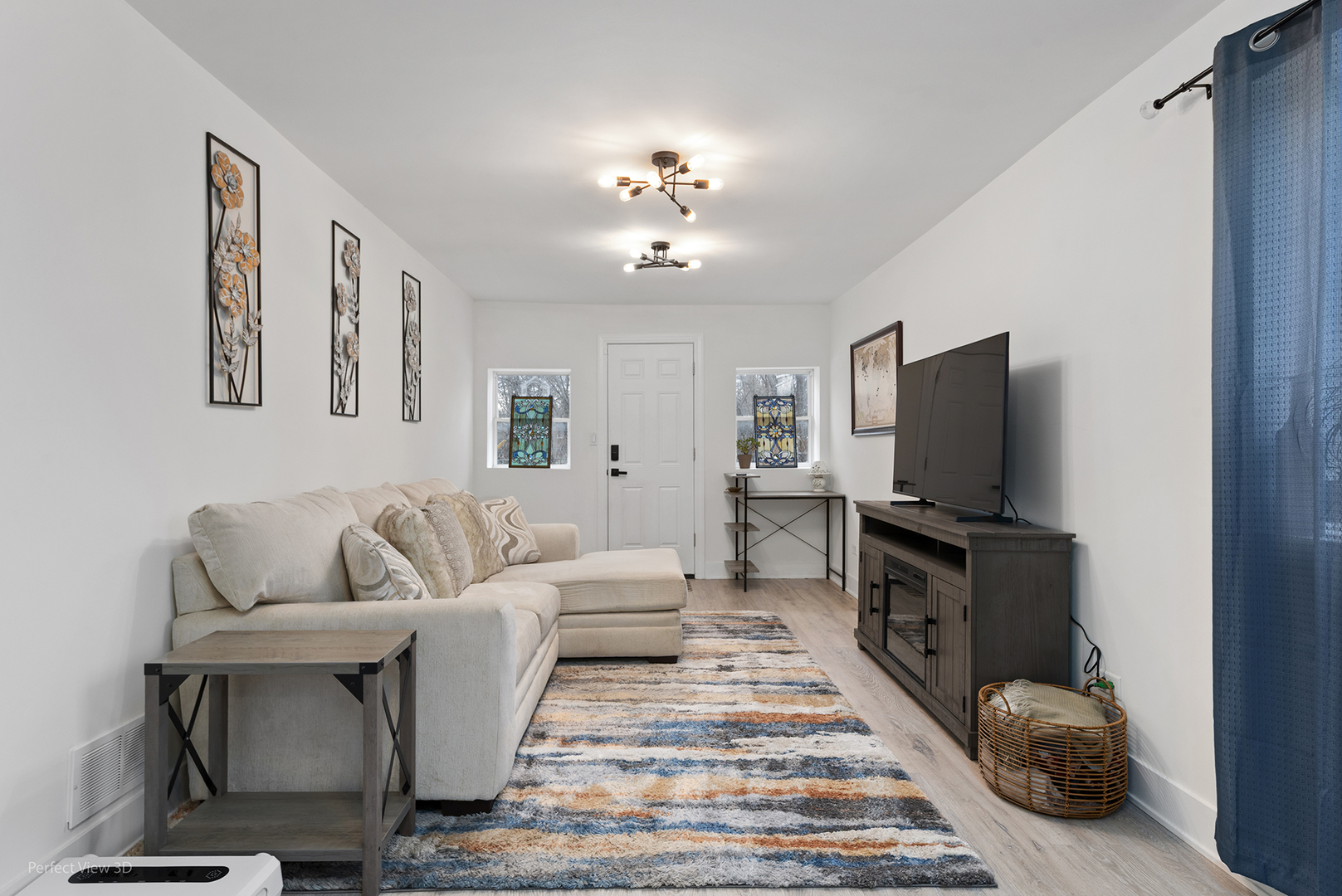128 South Villa Avenue Addison, IL 60101 - Photo 10 of 27 a living room with furniture and a flat screen tv