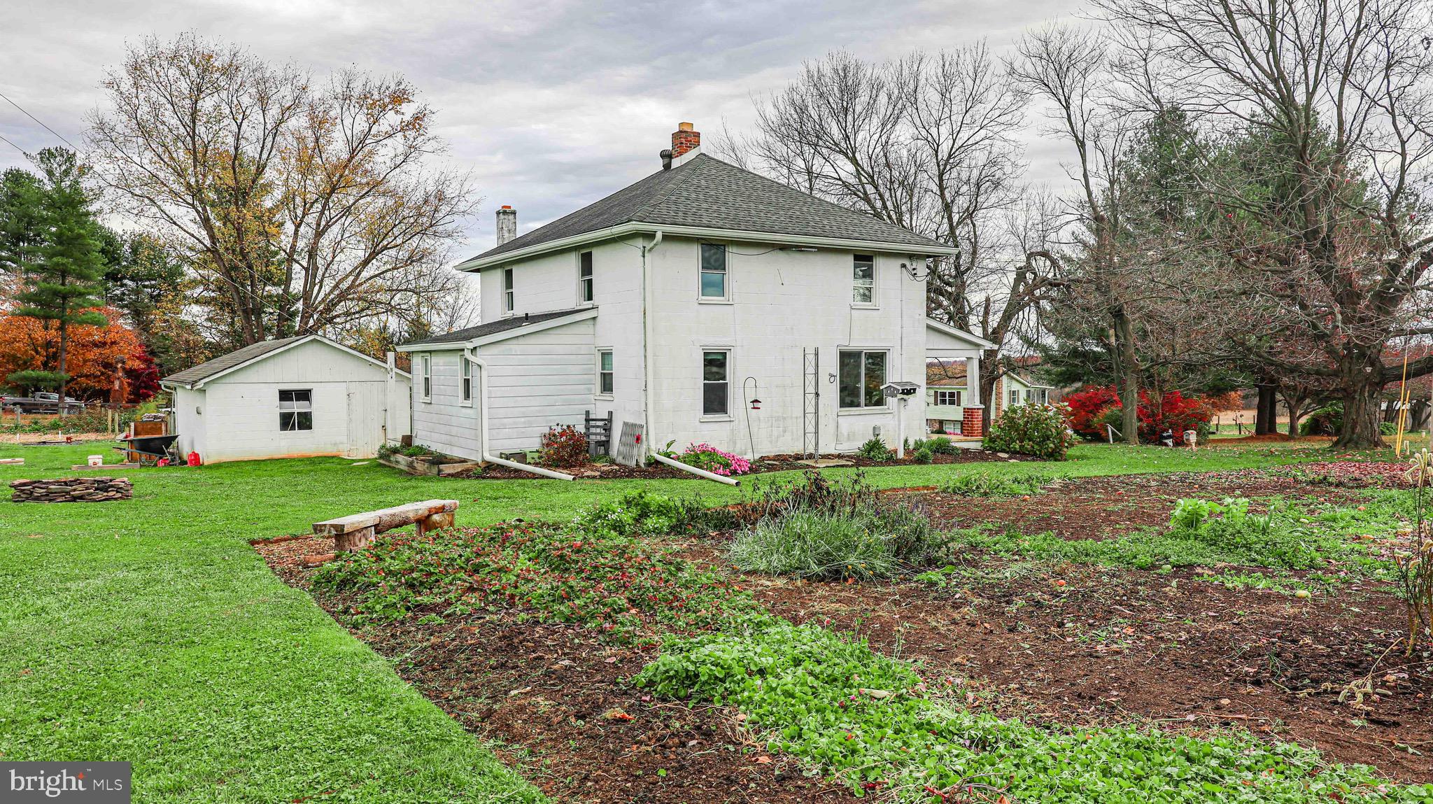 54 Mitchell Road Airville, PA 17302 - Photo 34 of 35 a view of a white house with a big yard and large trees