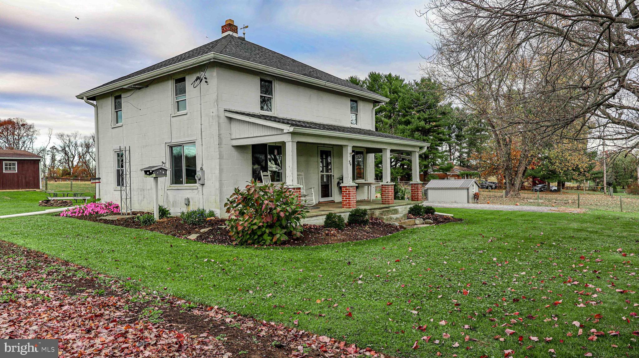 54 Mitchell Road Airville, PA 17302 - Photo 5 of 35 a view of a house with backyard sitting area and garden