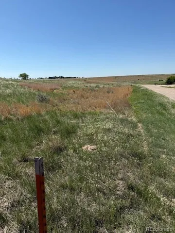 a view of a lake with couches and city view