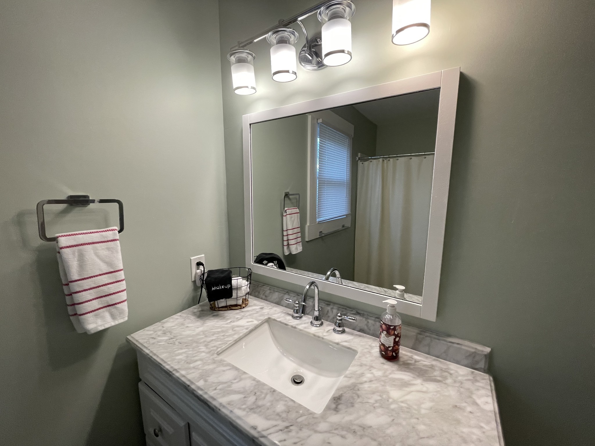 202 Shasteen Street Estill Springs, TN 37330 - Photo 18 of 35 a bathroom with a sink vanity and mirror