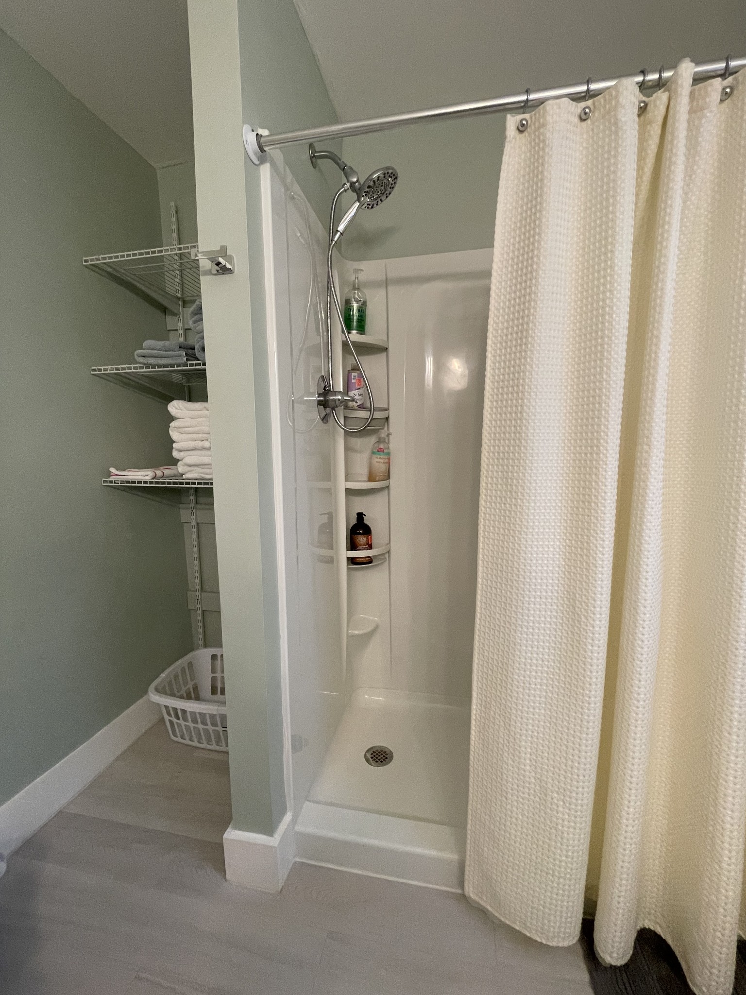 202 Shasteen Street Estill Springs, TN 37330 - Photo 20 of 35 a bathroom with a glass shower door and a sink