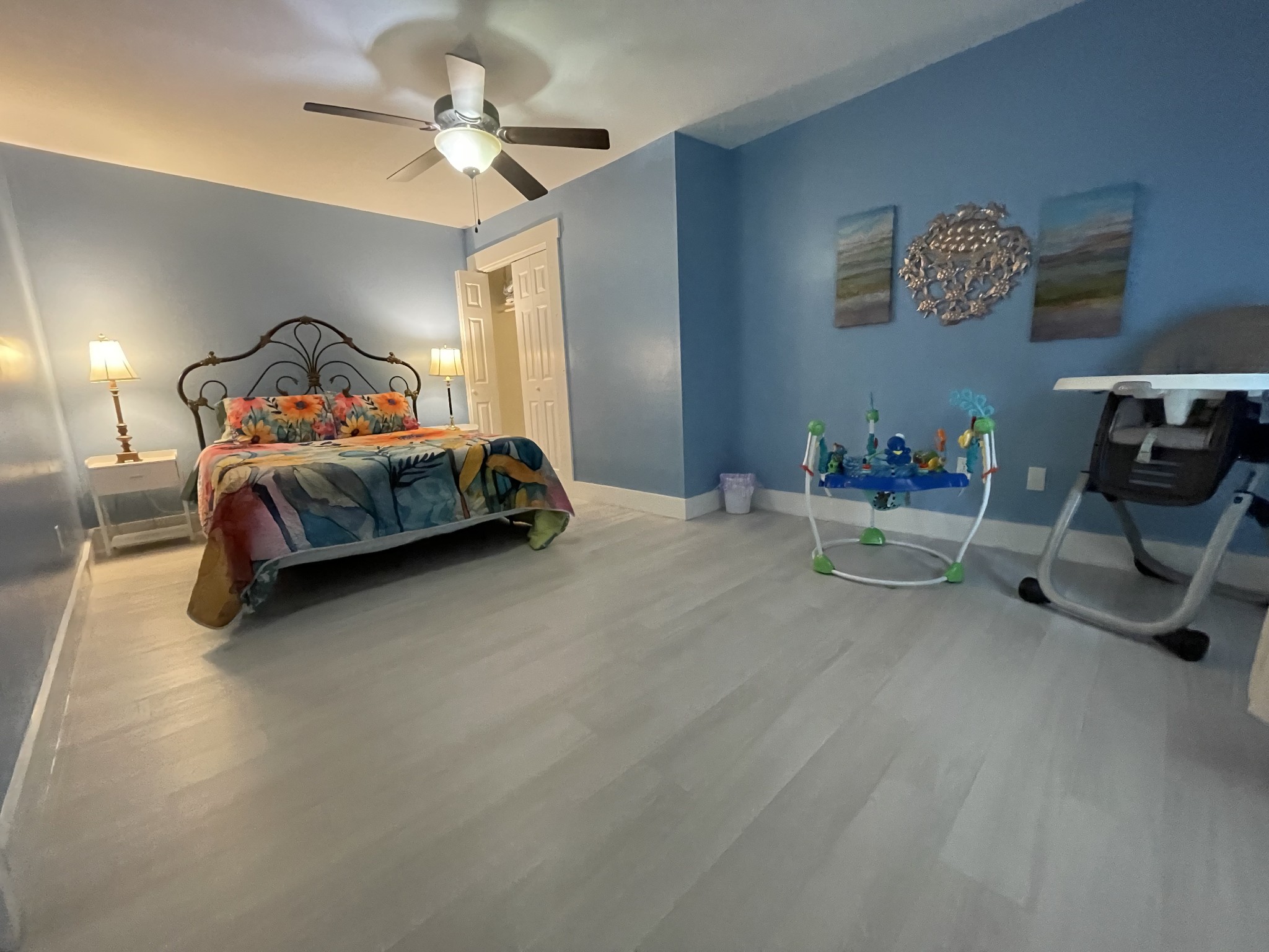 202 Shasteen Street Estill Springs, TN 37330 - Photo 21 of 35 a bedroom with a bed and a chandelier