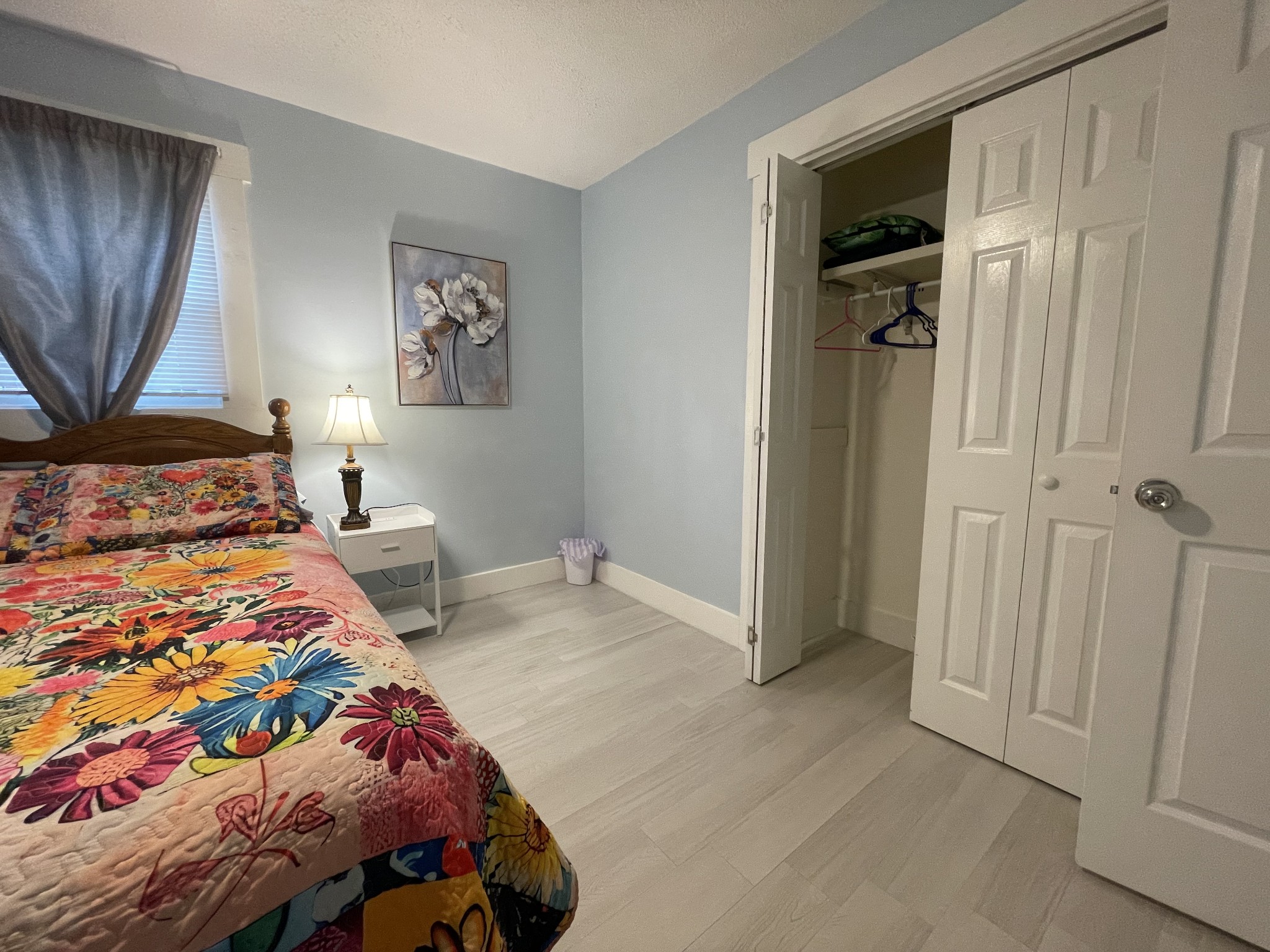 202 Shasteen Street Estill Springs, TN 37330 - Photo 26 of 35 a bedroom with a bed and a painting on the wall