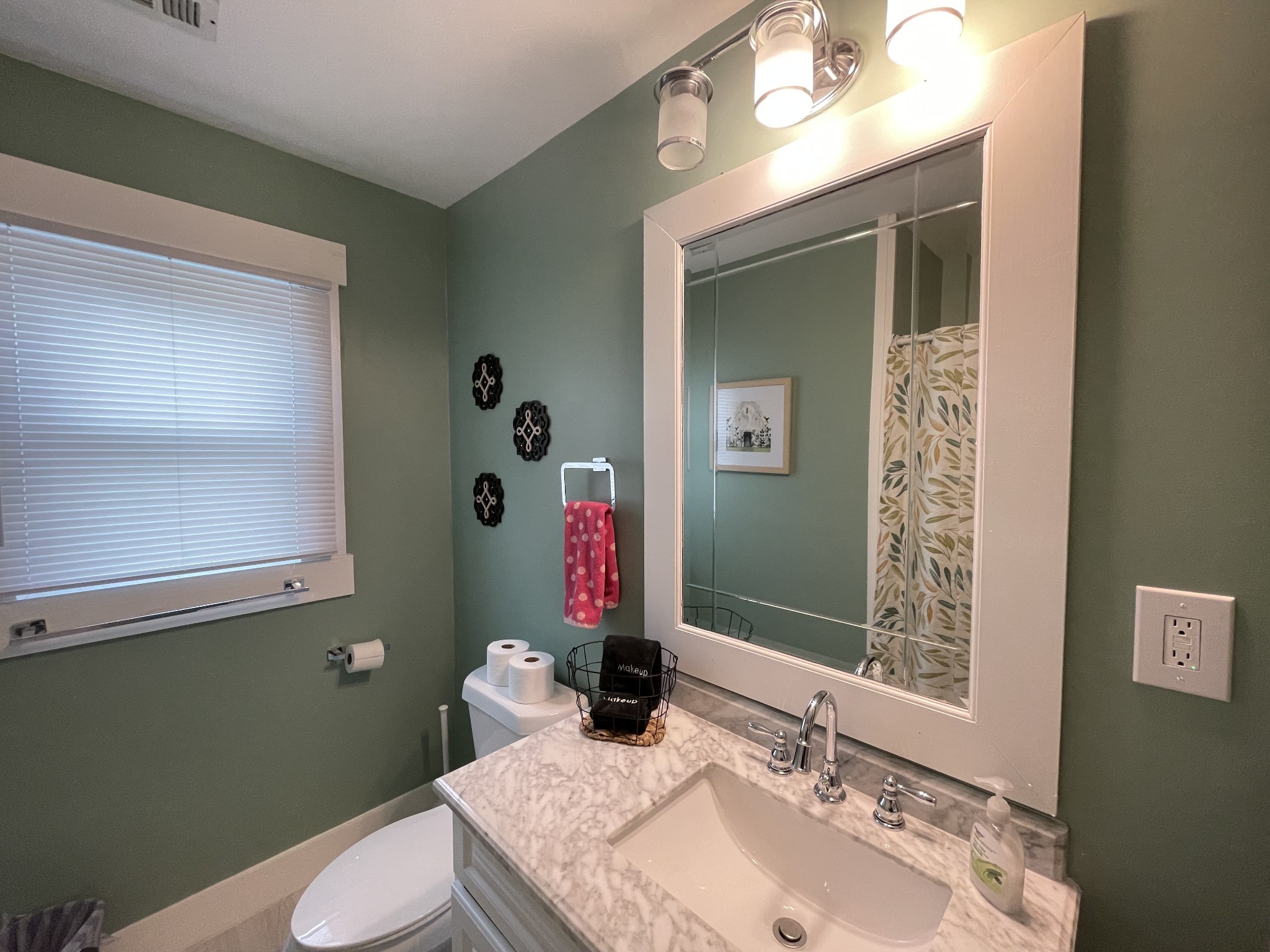 202 Shasteen Street Estill Springs, TN 37330 - Photo 29 of 35 a bathroom with a granite countertop sink toilet and mirror