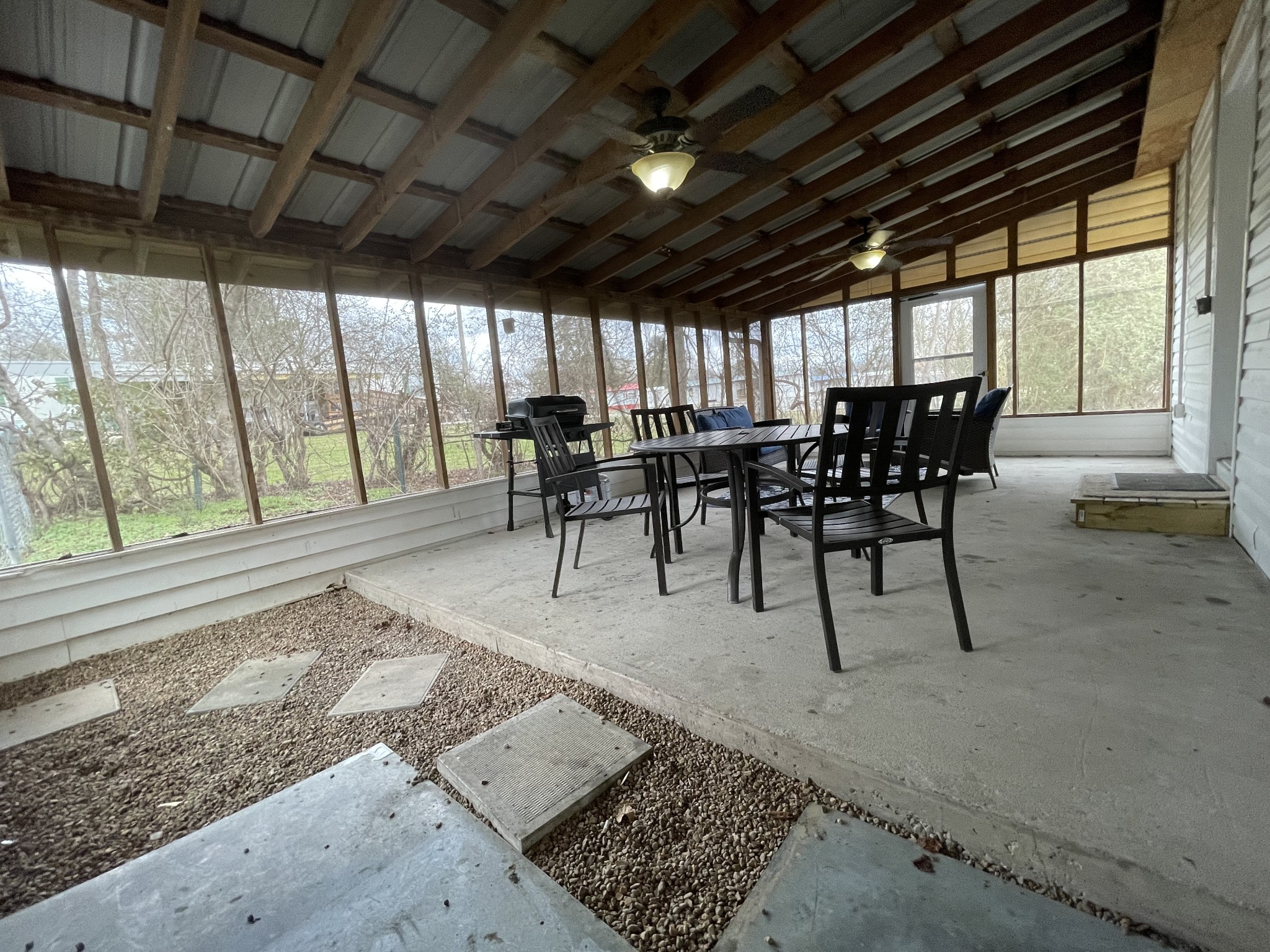 202 Shasteen Street Estill Springs, TN 37330 - Photo 35 of 35 a view of a patio with table and chairs with wooden floor and fence