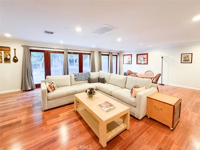 a living room with furniture or window and a wooden floor