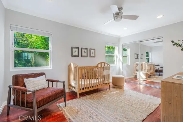 a bedroom with furniture and a window