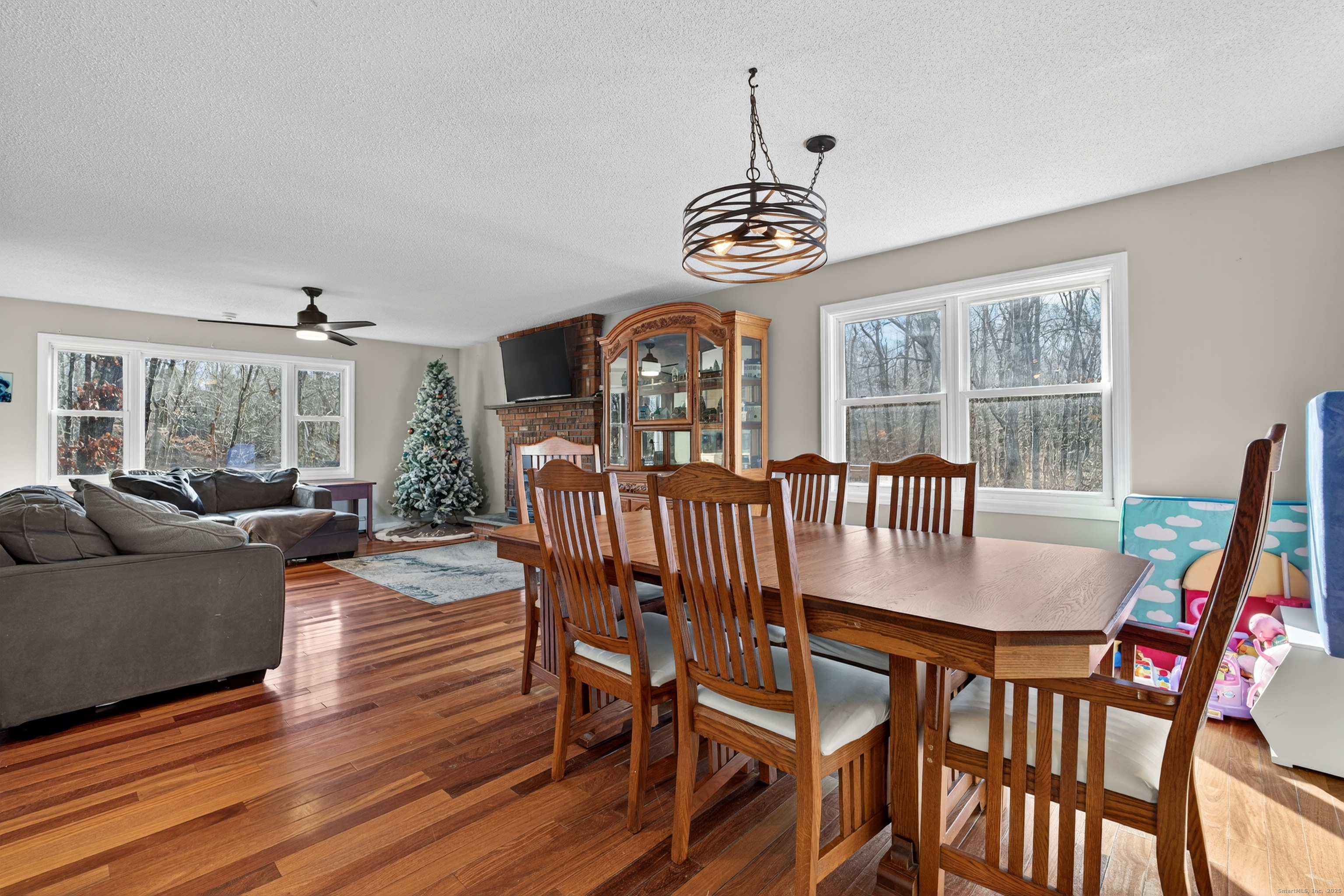 116 Spicer Hill Road Ledyard, CT 06339 - Photo 13 of 29 a view of a dining room with furniture window and wooden floor