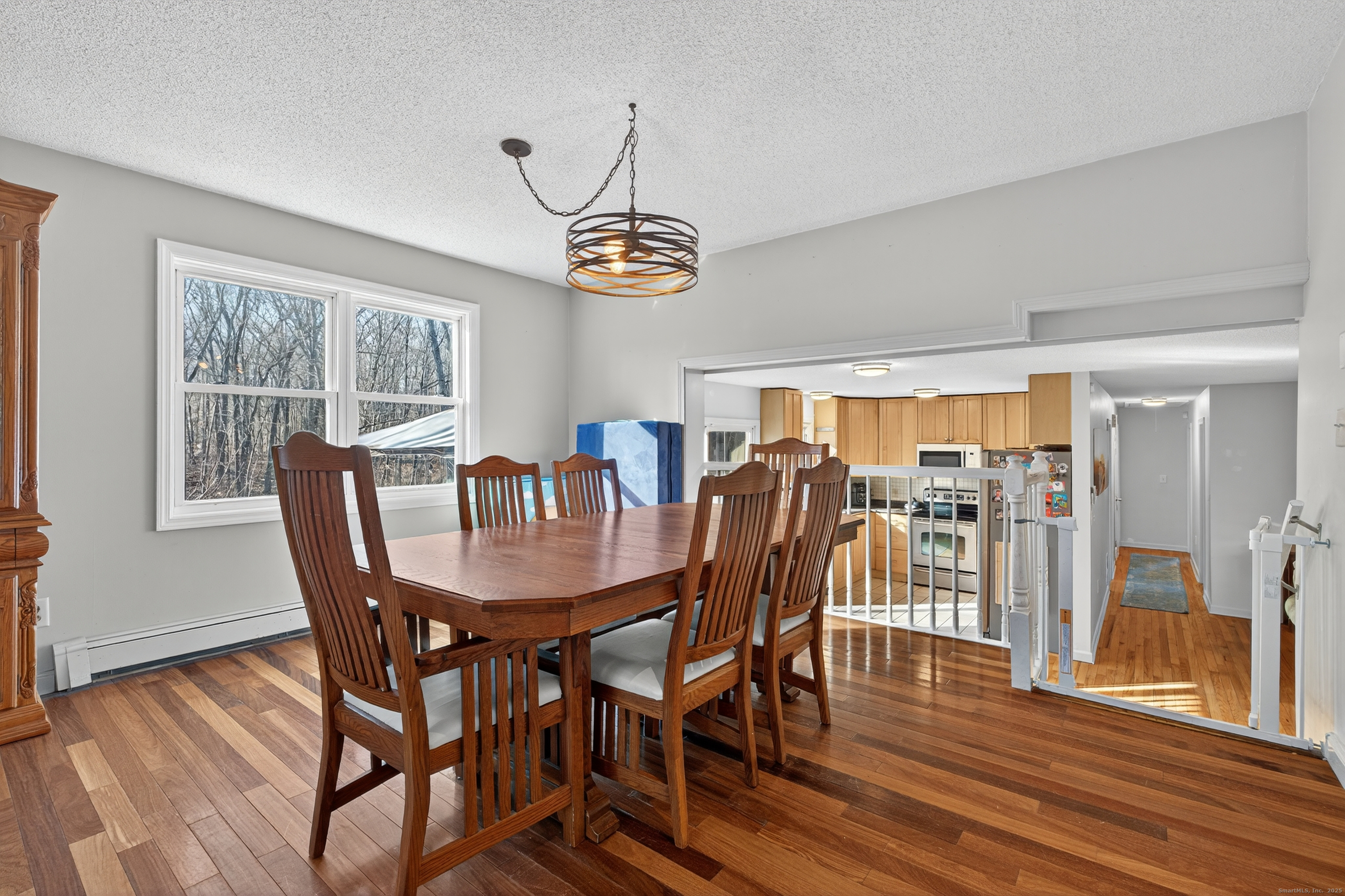 116 Spicer Hill Road Ledyard, CT 06339 - Photo 14 of 29 a view of a dining room with furniture window and wooden floor