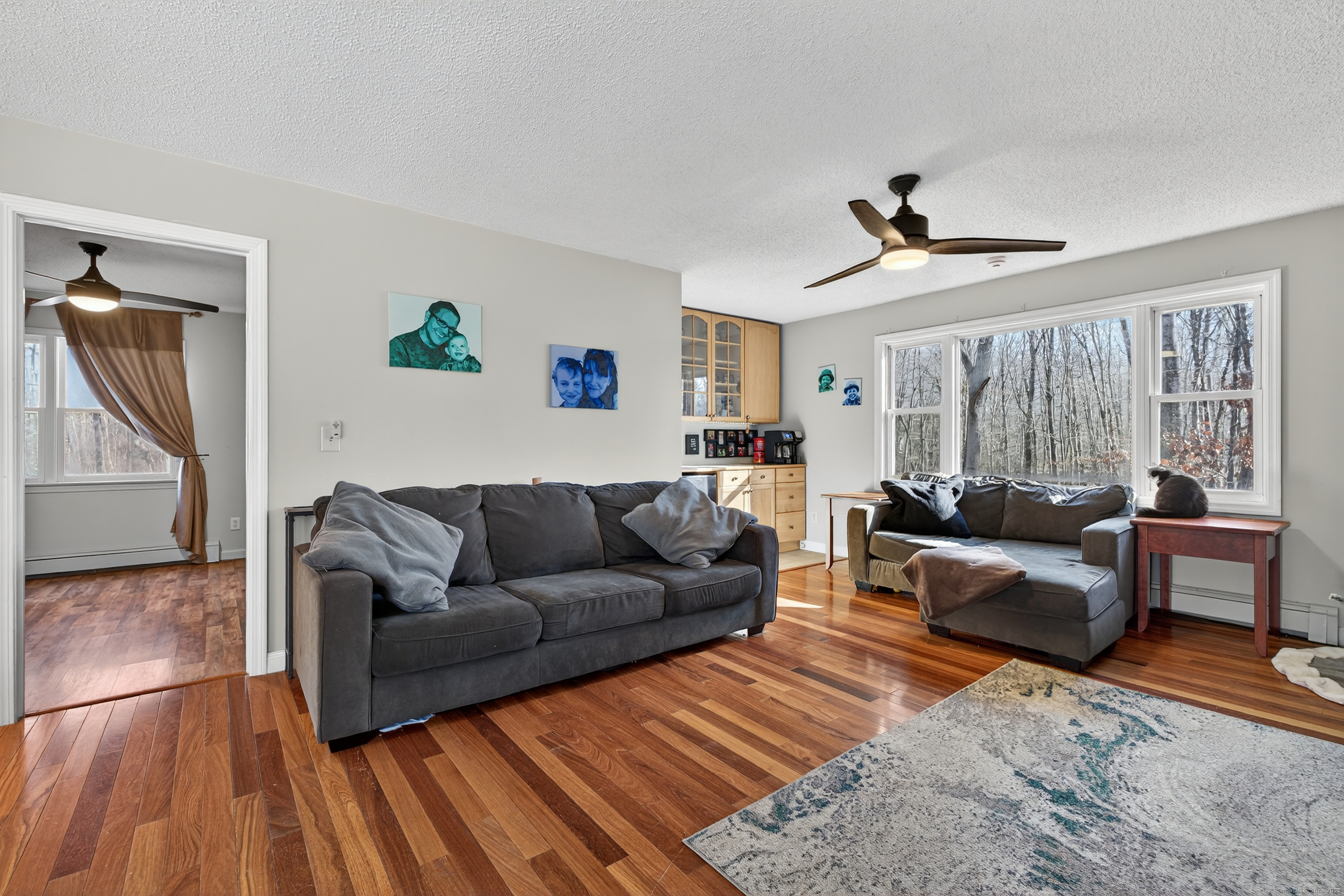 116 Spicer Hill Road Ledyard, CT 06339 - Photo 16 of 29 a living room with furniture and a wooden floor